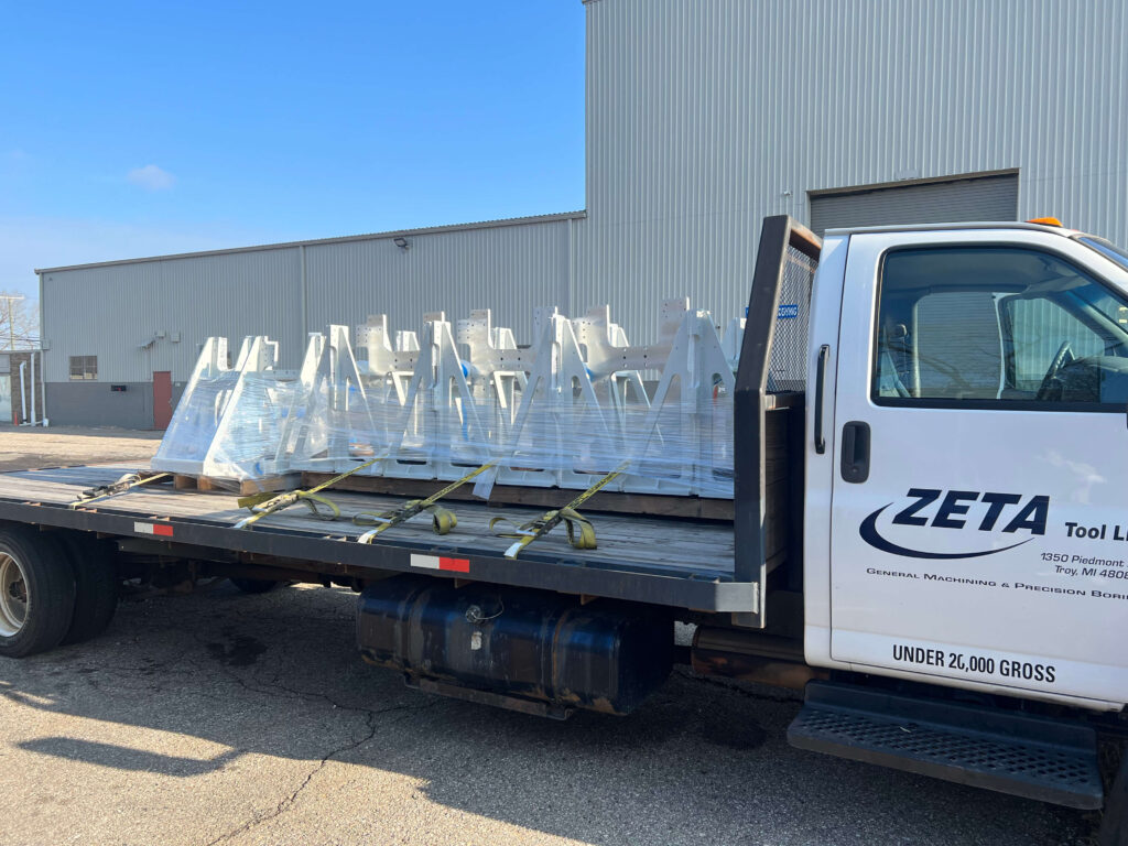 Machined parts on the back of a Zeta Tool flatbed truck